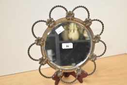 A mid 20th century French circular bevelled edge wall mirror, beautiful gilt floral surround with