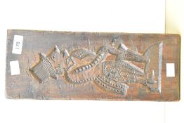 A late 19th/early 20th century solid wooden plaque/ possibly a mould cared as a depiction of a