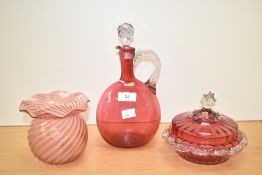 A late 19th century cranberry glass decanter, h26cm, sold alongside a cranberry powder bowl,