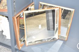 Three modern beval egded square wall mirrors, supported in a faux wood surround, fixtures to the