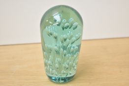 A Victorian green glass 'jelly fish' dump weight with enclosed air bubbles, 12cm.