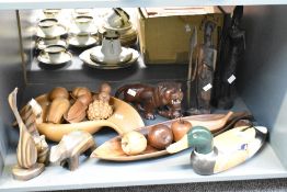 A collection of carved wooden ornaments, to include fruit bowls, fruit, African figures, tiger,