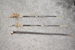 A pair of reproduction swords, decorated with knights coat of arms, 86cm, sold together with a