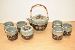 An attractive 20th century Japanese pottery teaset, comprising teapot, tea canister and six cups,