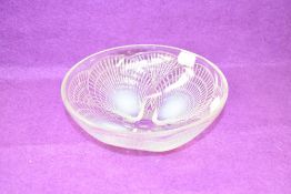 A Lalique opalescent glass Coquilles pattern bowl, etched Lalique France to base, 18.5cm.