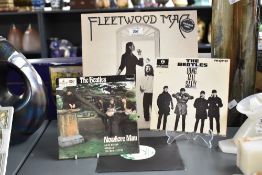 A 12' Fleetwood Mac Lp, LIMITED EDITION, Coloured vinyl, sold together with two 7' Beatles Lp's