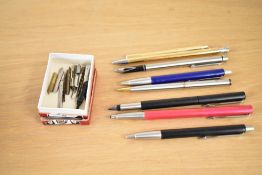 A Sheaffer USA brushed metal fountain pen sold together with selection of mixed ball point pens ma