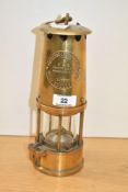 An Unused brass Protector Lamp & Lighting Company miners lamp, type 6. 25cm