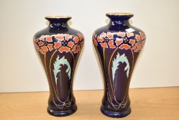 A pair of early 20th century Karlsbad Austrian porcelain vases, of Art Nouveau design, printed