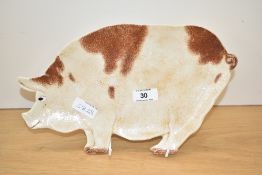 A 20th century Gisela Graham pottery pig platter, applied makers label to the reverse 30cm