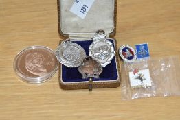 A selection of mid 20th century sporting medallions, pin badges, sold together with a United Nations