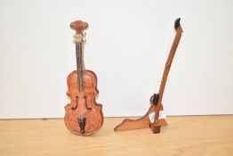 A modern wooden miniature chello on stand, 18cm.