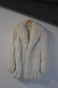 A 1980s Continental Furs ladies white-beige 3/4 length coat, in shadow fox fur - the coat is