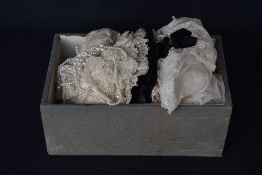 Two handmade baby bonnets or coifs, in off white French or Alencon lace, featuring floral embroidery