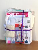 A bundle of sewing patterns and haberdashery, including: A vintage 1980s-1990s McCalls pinafore