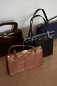 Four 1960s frame bags in good condition. A 1960s black patent style featuring playful pout shaped