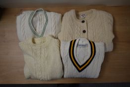Four peices of 1970s childrens knitwear in cream, comprising a unisex cable-knit crew-neck