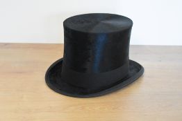 Two antique top hats, one G.A.Dunn & Co. squire/high top hat in all black silk, a few signs of