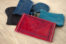 Five vintage leather coin purses. Four are navy and/or brown and have key rings attached, one is red