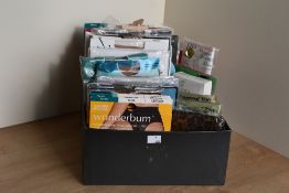 A box of assorted vintage hosiery, in a range of brands, colours, patterns and sizes.