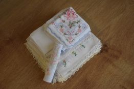 Twenty-four vintage handkerchiefs, featuring a range of styles and designs, some hand embroidered.