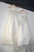 Six modern wedding dresses, having various cuts and styles, mostly with embellishment, comprising