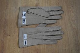 A pair of vintage pigskin leather gloves, beige with black contrast hand-stitching. Size 7 1/2.