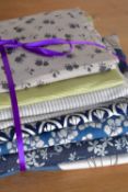 Six cuttings of vintage fabrics in classic floral patterns, pinstripes and cool colours. Varying