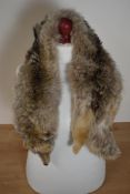 A vintage Blue Fox genuine fur stole, having head, legs and tail intact, with glass eyes and an