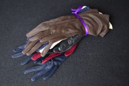 Five pairs of vintage ladies gloves, comprising one blue-black leather pair, and four man made