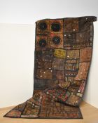 A 1960s handmade wall-hanging example of Shisha embroidery, in shades of brown, featuring a