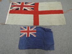 Two British Naval White Ensign Flags 175cm x 90cm and 220cm x 130cm along with a British Blue Ensign