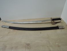 An Indian Cavalry curved Sword, decorated blade with metal three band guard, wood, metal and leather