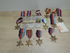 A collection of WWII Medals, War Medal x4, Defence Medal x 3, 1939-45 Star x 6, Africa Star x2,