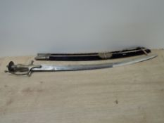 An Indian Tulwar Sword with cloth, wood and metal scabbard, decorated blade and with Made In