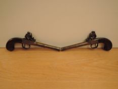 A pair of 19th century possible Duelling Pistols, one marked Parker London, other marked London,