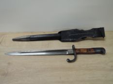 A British 1907 Pattern Bayonet having hooked quillion and wooden handle, no marking to blade, with