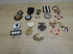 A collection of Nursing Medals and Badges including, Service Medal of the Order of St John named