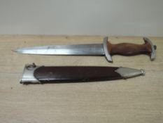 A WWII German SA Service Dagger with scabbard, makers mark Carl Wusthof Solingen, blade marked RZM