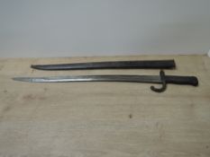 A French Lebel Epee Bayonet, guard numbered 76128, script to top of blade with date 1873, blade