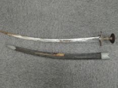 An Indian Tulwar Sword having metal guard and grip, blade length 80cm, overall length 90cm, no
