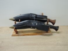 Two Gurkha Kukri Knives both having wood handle with two smaller knifes, blade lengths 25cm, overall