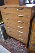 A vintage laminate chest of seven long drawers, labelled Europa