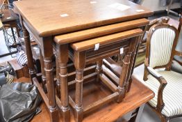 A mid to late 20th Century oak nest of three tables, top table width approx. 51cm
