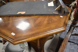 A late 20th Century hardwood octagonal dining table and set of four similar cane backed carver
