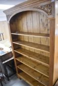 A stained pine bookshelf, height approx. 213cm
