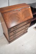 A reproduction Regency style bureau