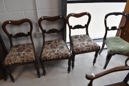 A set of three Victorian mahogany balloon back chairs and another similar