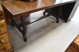 A mid to late 20th Century oak refectory style extending dining table, closed size approx. 158 x