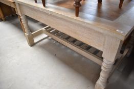 A modern limed oak kitchen table having integral butchers block, very heavy, approx. 152 x 97cm
